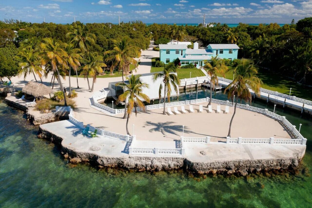 Large bay-front home with dockage, pool and beach in the heart of Islamorada