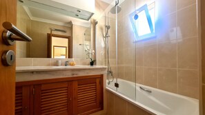 Bathtub, hair dryer, towels