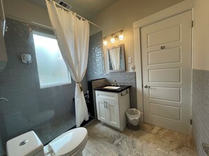 Shower, hair dryer, towels, soap