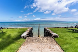 Enjoy the serene ocean views from the comfort of a bench or lounge chair.