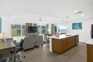 Deluxe Suite, 2 Bedrooms, Ocean View | Living area | 65-inch LCD TV with cable channels, TV