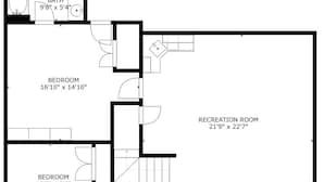 Pianta degli interni di una casa con due camere da letto, un bagno e una sala ricreativa.