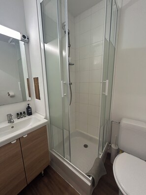 Bathtub, hair dryer, towels, soap