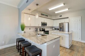 Fridge, microwave, oven, stovetop - 301 Bay Harbor – Waterfront Luxury, Balcony Views, Heated Pool & Walk to Clearwater Beach (Clearwater Beach)