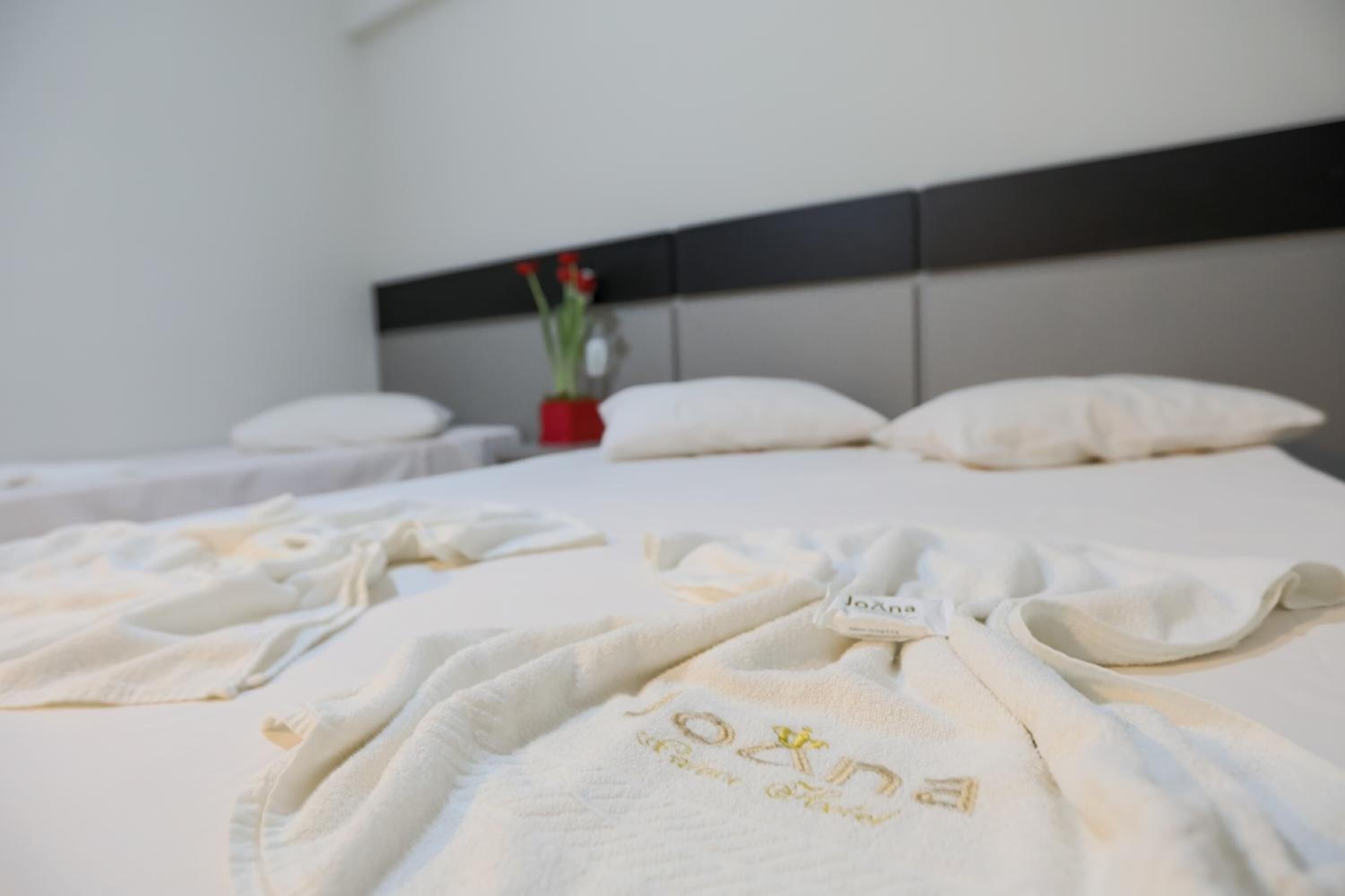 desk, laptop workspace, bed sheets