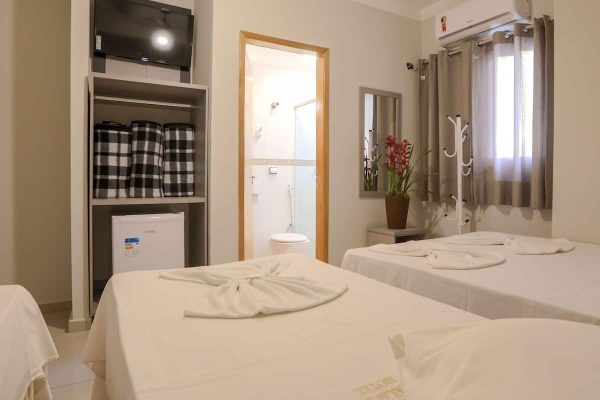 basic triple room | desk, laptop workspace, bed sheets