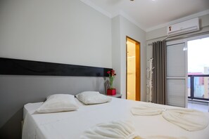 Desk, laptop workspace, bed sheets