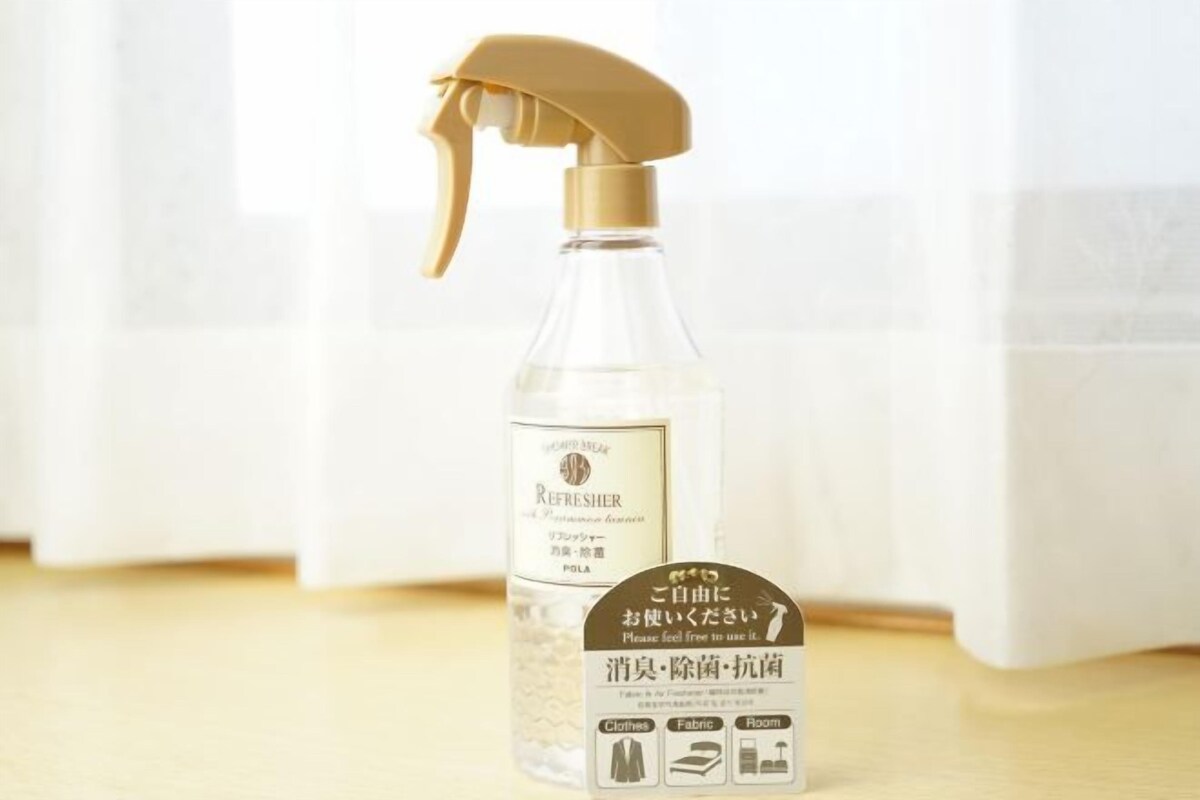 A spray bottle with a label indicating it is a room freshener.