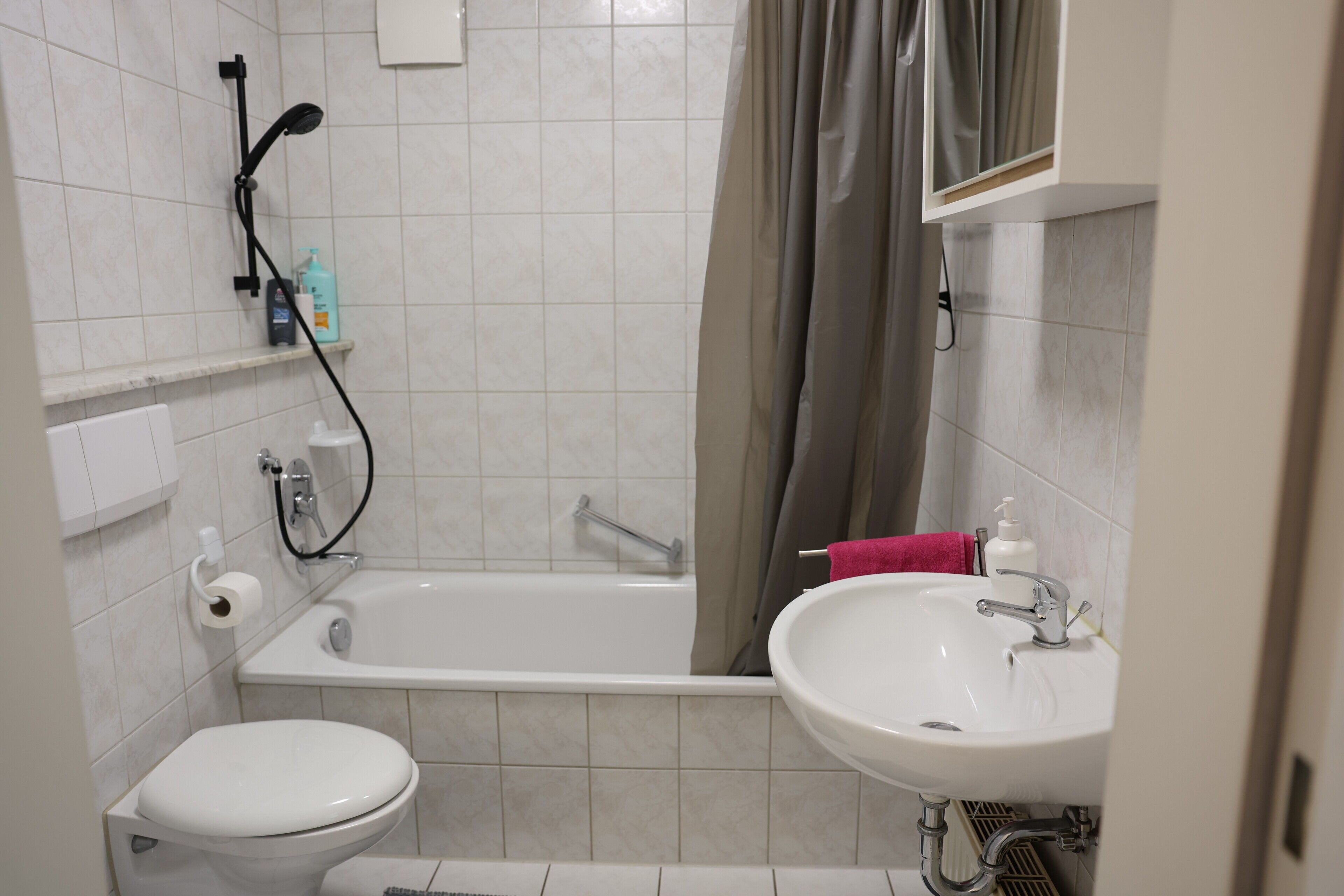 Bathtub, hair dryer, towels