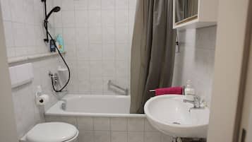 Bathtub, hair dryer, towels