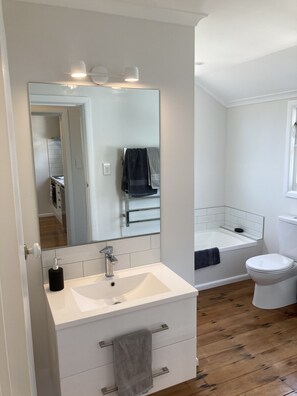 Bathtub, hair dryer, towels, soap