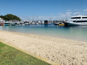 Enjoy serene waterfront views and access to a sandy beach.