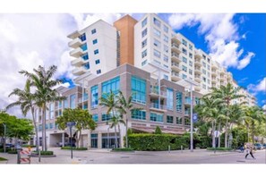 Stunning hotel building with modern design, large windows, and balconies.
