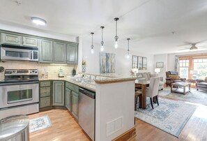 Dishwasher, coffee/tea maker, cookware/dishes/utensils, dining tables
