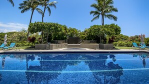 A swimming pool with clear blue water, surrounded by palm trees and lounge chairs. - Vista Waikoloa G204 Golfers Getaway, Gold Golf Kings Membership!! (Waikoloa,)