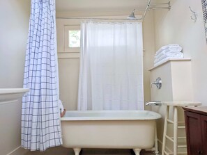 Bathtub, hair dryer, towels
