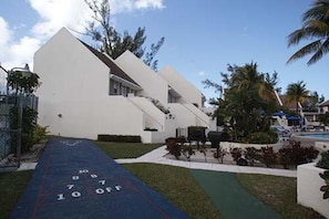 Enjoy leisure time at this single-story building with a shuffleboard court, pool, and beautifully maintained grounds.