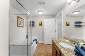 Combined shower/tub, hair dryer, towels, soap
