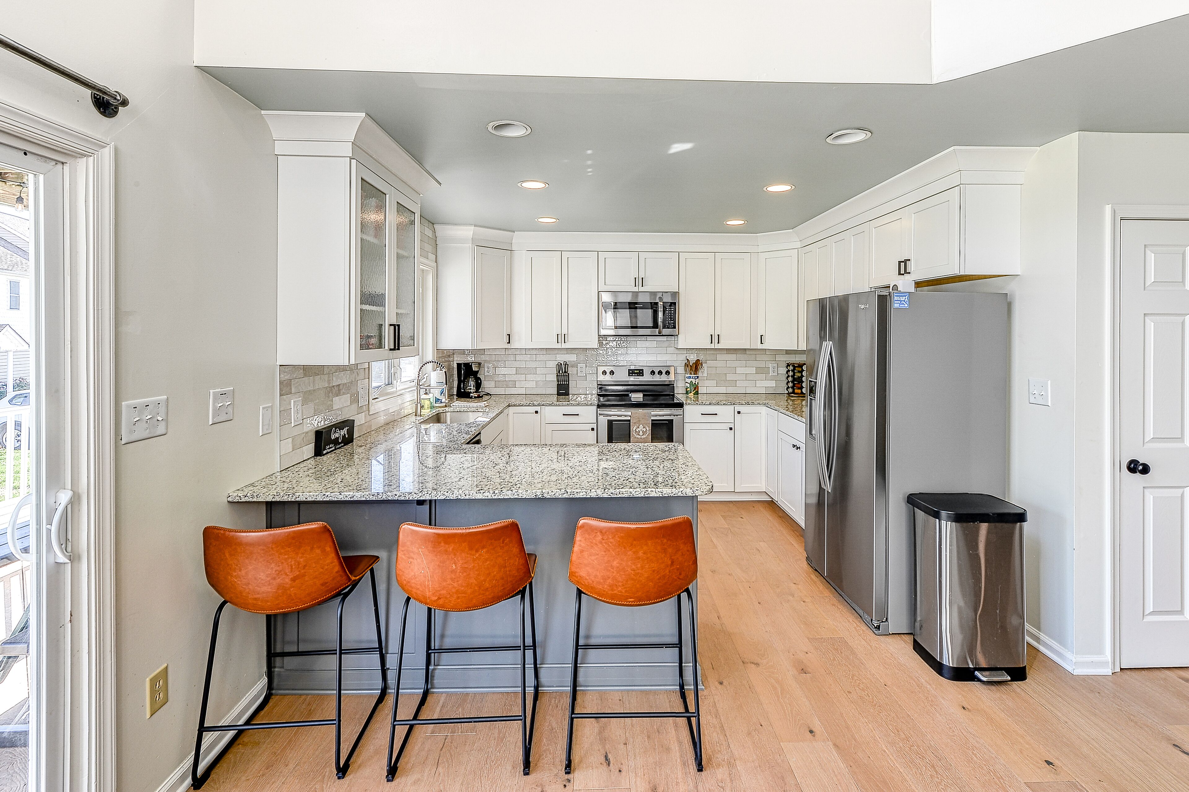 Three-story lakefront home w/ covered boat slip, and tennis/pickleball access