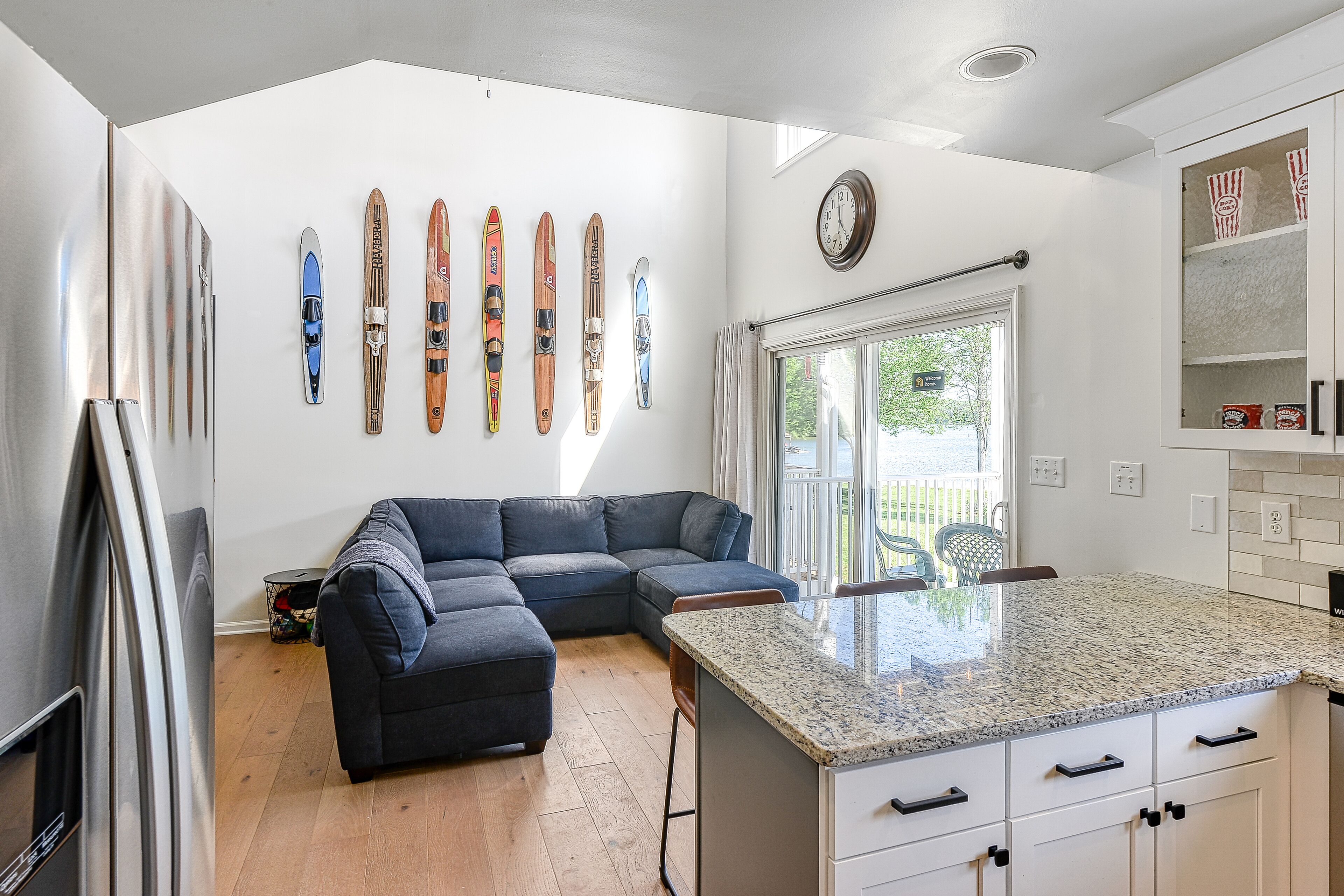 Three-story lakefront home w/ covered boat slip, and tennis/pickleball access