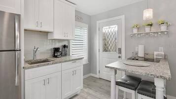 Fridge, microwave, stovetop, coffee/tea maker