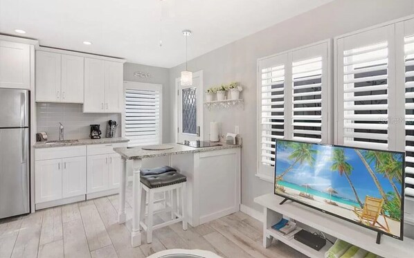 Fridge, microwave, stovetop, coffee/tea maker