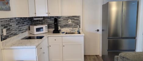 Fridge, microwave, coffee/tea maker, toaster