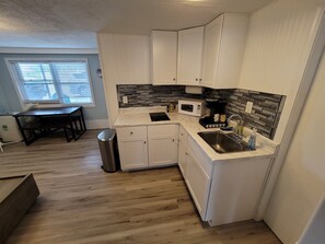 Fridge, microwave, coffee/tea maker, toaster
