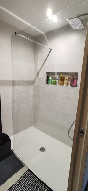 Bathtub, hair dryer, towels, soap