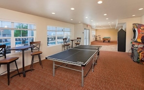 Relax and have fun in our indoor recreational area, featuring a ping pong table, pool table, and arcade machine.