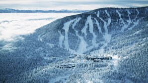 A snow-covered mountain with a ski resort, including cabins and ski trails. - Ritz Carlton Club, Lake Tahoe - 4 Bedroom (Truckee)