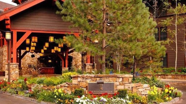 Experience the charm of a traditional architectural style at The Ritz-Carlton Club, set amidst a beautifully maintained garden.