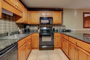 Enjoy cooking in this well-equipped kitchen with a dishwasher, double oven, and microwave.