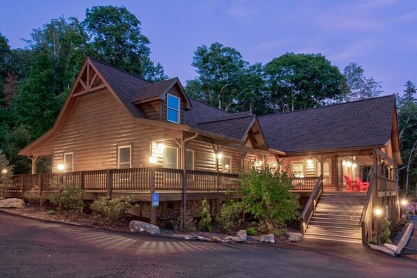 Stroll up to the lodge's inviting porch, where a set of stairs leads to a comfortable seating area.
