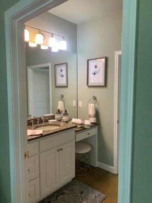 Bathtub, hair dryer, towels, soap