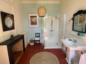 Bathtub, hair dryer, towels, soap