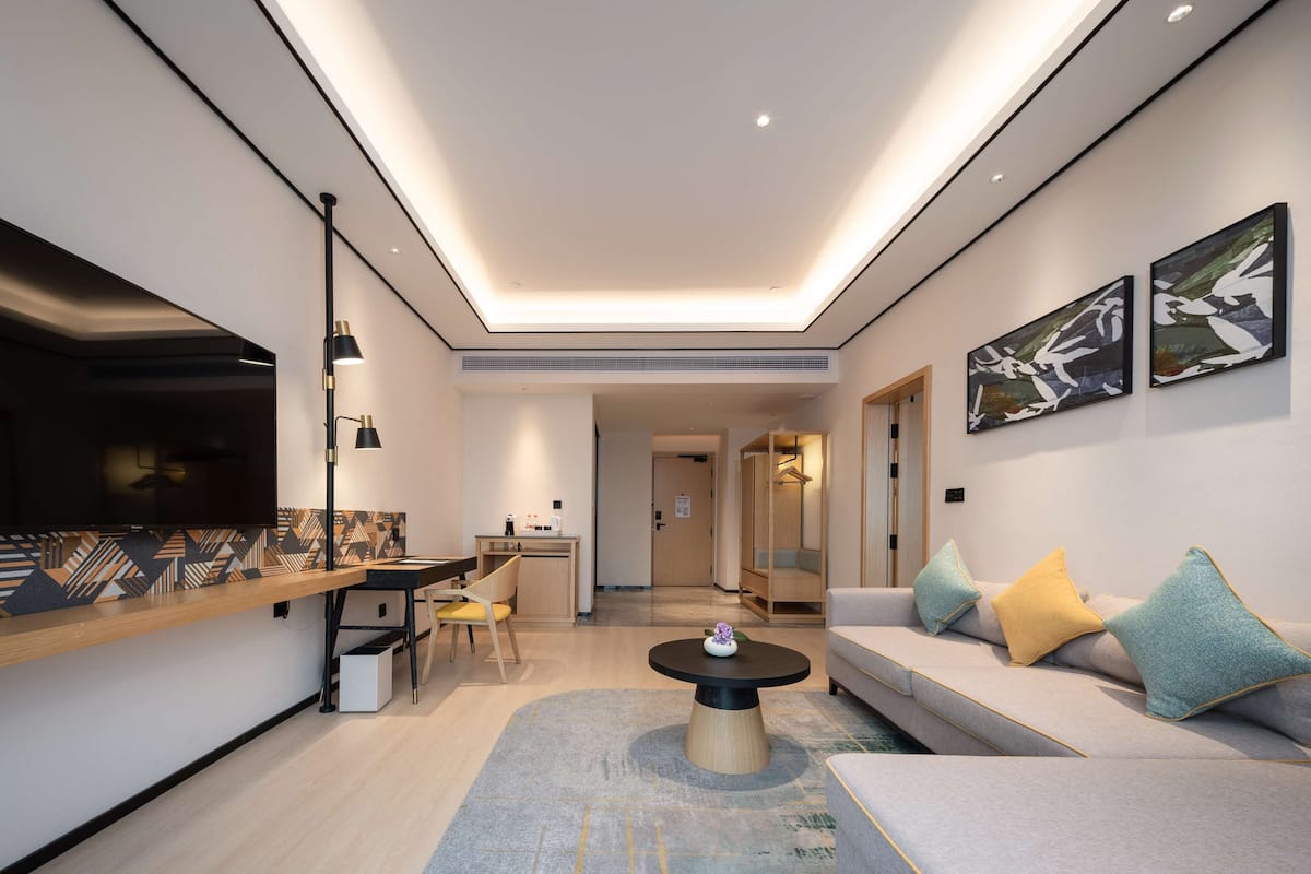 Premium Suite, 1 King Bed | 1 bedroom, premium bedding, pillow-top beds, in-room safe