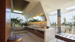 A modern bathroom with a large sink, a mirror, and a wooden barrel. - Where Tranquility Meets Luxury – Bali Villa 1071 (Bali)