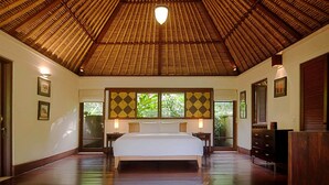 A spacious bedroom with a large bed, wooden ceiling, and a view of greenery outside. - Luxury Hillside Retreat with Private Pool – Bali Villa 1049 (Bali)