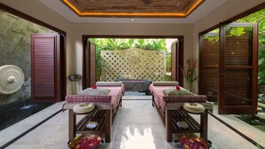 A spa room with two massage tables, a wooden ceiling, and a view of lush greenery outside. - Elegant Estate with Private Pool - Bali Villa 1007 (Bali)