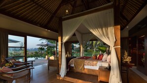A four-poster canopy bed with a view of a tropical landscape. - Elegant Estate with Private Pool - Bali Villa 1007 (Bali)