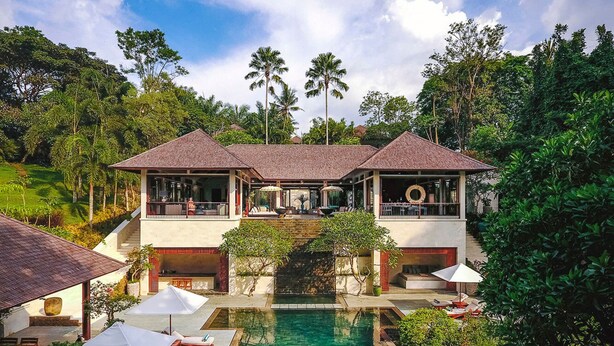 A resort with a pool, lounge chairs, and a view of the surrounding greenery. - 5 Star Villa in Bali, Minutes from the Beach, Bali Villa 1026 (Bali)
