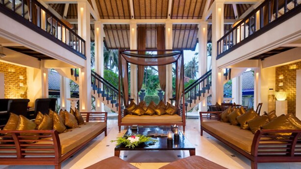 A spacious lobby with a central seating area, a staircase, and a view of greenery outside. - Seaside Serenity with Private Pool – Bali Villa 1016 (Bali)
