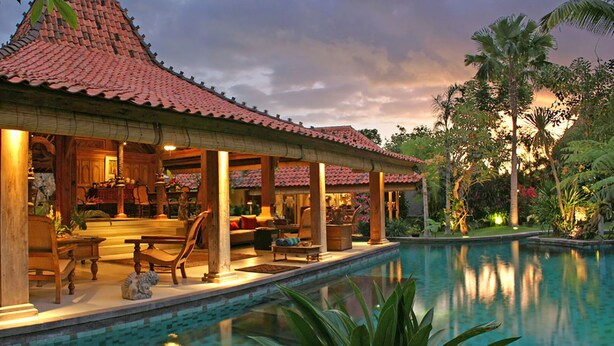 A resort with a pool, covered seating area, and tropical landscaping. - Seminyak’s Hidden Gem of Grace, Bali Villa 1101 (Bali)