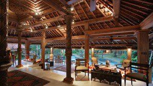 A spacious indoor area with a high ceiling, wooden beams, and a view of a tropical garden. - Seminyak’s Hidden Gem of Grace, Bali Villa 1101 (Bali)