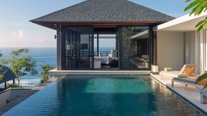 A modern villa with a private pool, a bedroom with a view of the sea, and a balcony with outdoor seating. - Experience Ultimate Luxury by the Beach, Bali Villa 1129 (Bali)