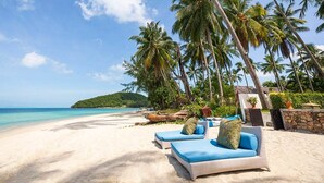 A beach with lounge chairs and palm trees. - Luxury Family Retreat with Private Chef, Koh Samui Villa 1001 (Koh Samui)