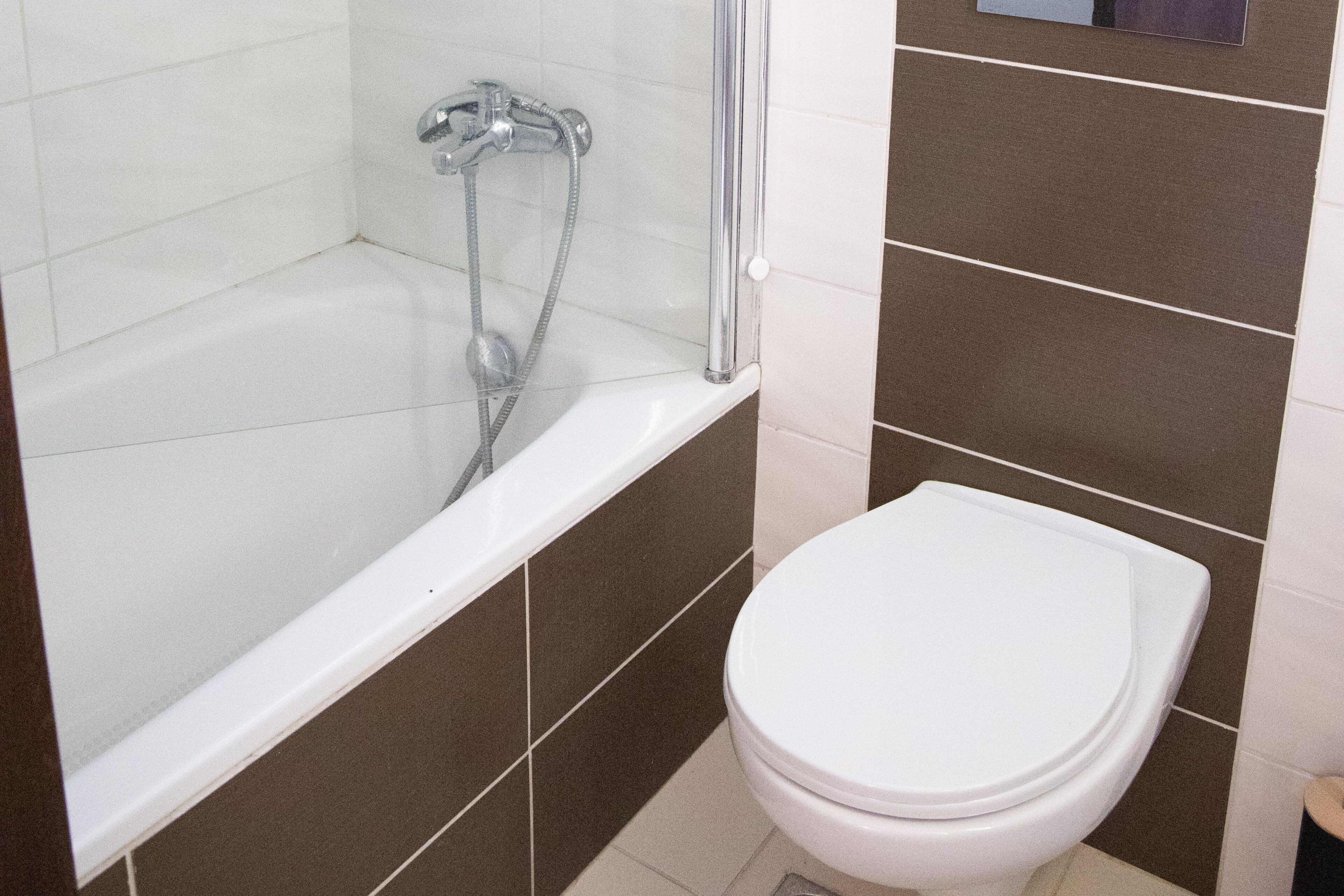 Shower, rainfall showerhead, hair dryer, towels