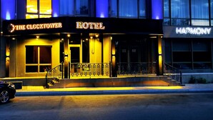 A hotel named "The Clocktower Hotel" with a prominent entrance and a visible staircase leading to the entrance. - The Clocktower Hotel (Baku)