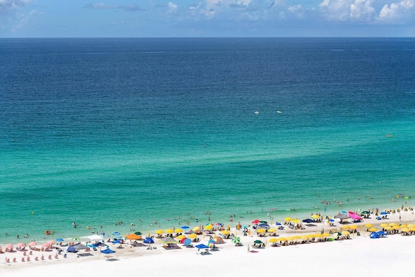 Enjoy the serene ocean views and relax on the beach with ample shade and seating.